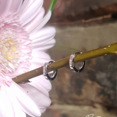 huggie hoops silver 7mm perfect for stacking with flower